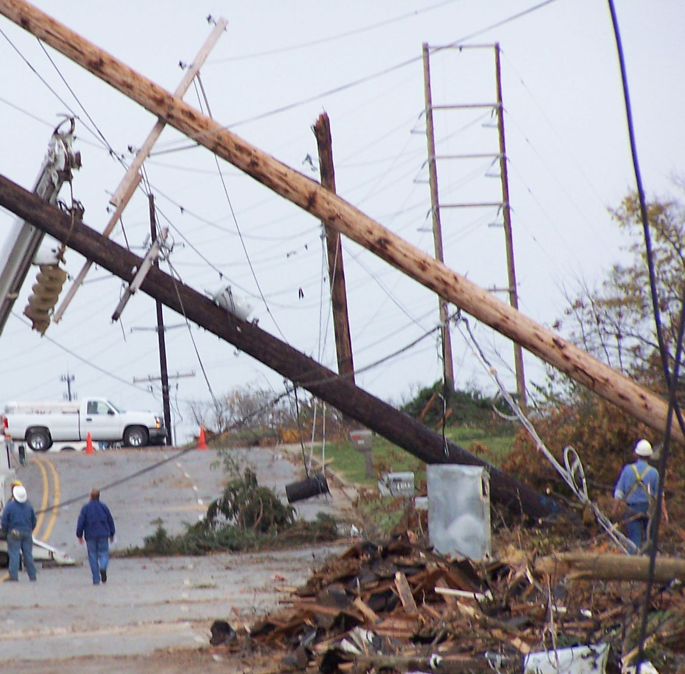 Workers repairing a downed power line